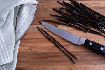 Organic Madagascar Vanilla Pods being sliced open to extract the beans