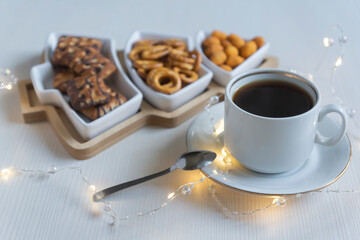 Cup of coffee and various sweets on a white background.