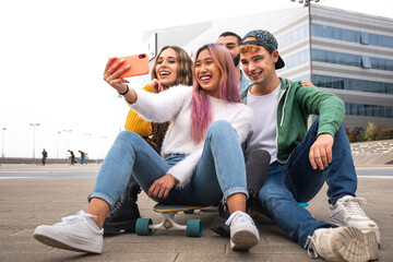 Happy group of friends takes a selfie outdoor. - obrazy, fototapety, plakaty