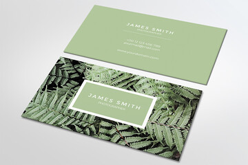 Elegant business card with palm leaves, white green black