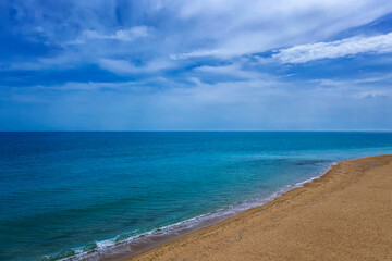 Fototapeta premium Vast aerial photo from drone to the beautiful coastline and sky