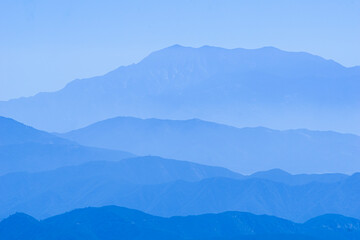 Blue mountains backdrop in tiered tones of blue