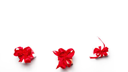 Valentine day composition: gift boxes with red bows on white background. with copy space. Top View.
