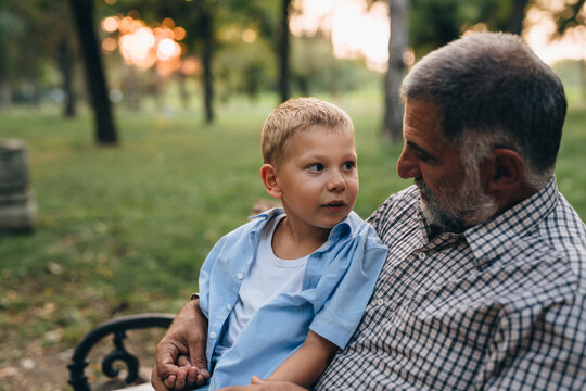 portrait of boy with his grandfather outdoor