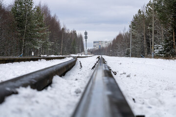 Railway in winter. Snow-covered railway tracks.