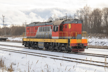 Train in winter. Old diesel locomotive on the railway.