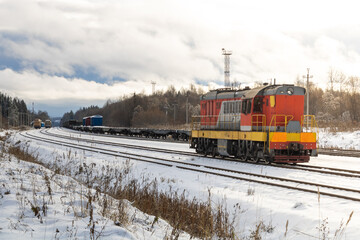 Train in winter. Old diesel locomotive on the railway.