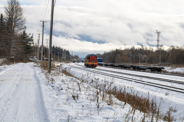 Train in winter. Old diesel locomotive on the railway.