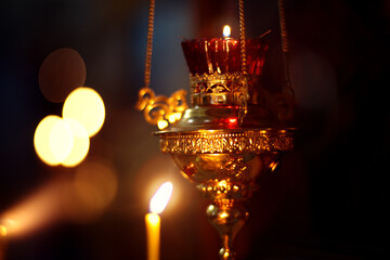 Church candle and lamp on the background of icon. The interior of the Orthodox Church. Religion.