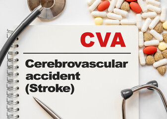 Page in notebook with CVA Cerebrovascular accident Stroke . on white background with stethoscope...