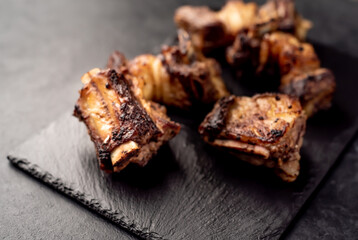 grilled beef ribs on a stone background