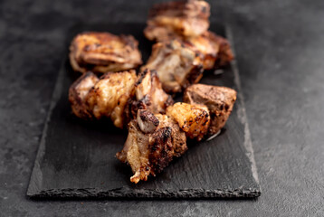 grilled beef ribs on a stone background