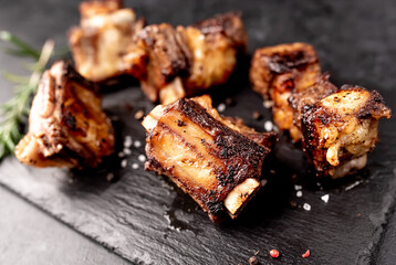 grilled beef ribs on a stone background