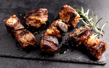 grilled beef ribs on a stone background