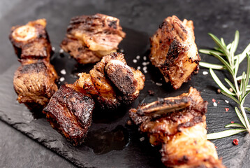 grilled beef ribs on a stone background