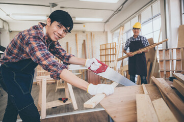 Craftsman carpenter team cooperating on building construction planning, working with wood