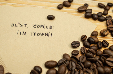 Best coffee in town slogan on coffee filter with stamps and beans