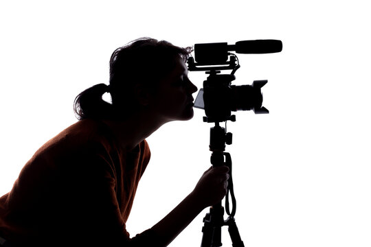 Silhouette of a female indie filmmaker, online content creator or casting director with a camera and mic on a white background