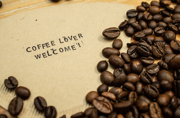 Coffee Lover welcome slogan on coffee filter with stamps and beans