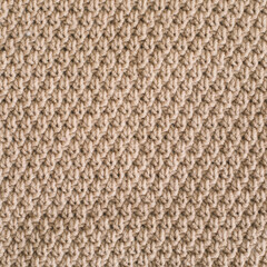 Knitted texture background. Knitting pattern of wool. Knitting. Texture of woolen fabric for wallpaper and abstract background.