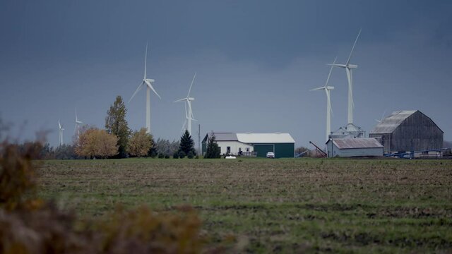 The Future And Tradition. Science And Technology With Grassroots Farming. Wind Farm Turbine In Motion. Generating Clean Power From Wind. The Future. Shot In 4k. 