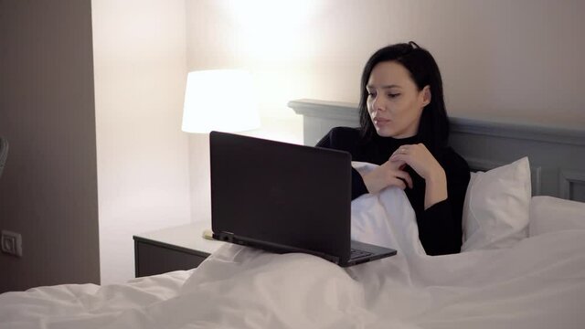 Happy and relaxed women watching video movie to laptop 