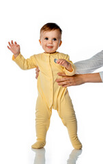 Little toddler child learning to walk studio portrait