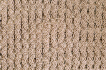 Knitted texture background. Knitting pattern of wool. Knitting. Texture of woolen fabric for wallpaper and abstract background.
