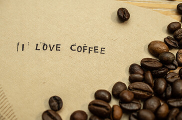 love coffee slogan on coffee filter with stamps and beans