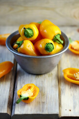 Selective focus. Yellow sweet peppers in a bowl. Paprika harvest.