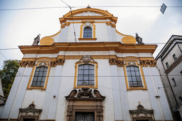 Obraz premium Beautiful Baroque Church of the Holy Trinity at Spalena street in the center of Prague during the autumn day, Czech Republic, Bohemia region