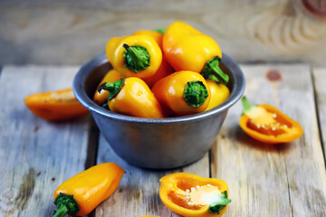 Selective focus. Yellow sweet peppers in a bowl. Paprika harvest.