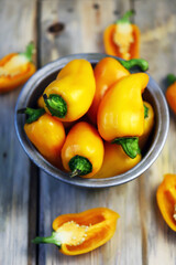 Selective focus. Yellow sweet peppers in a bowl. Paprika harvest.