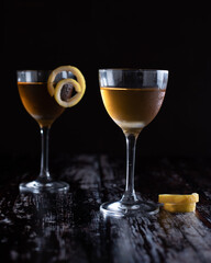 Two Sazerac cocktails with lemon garnish