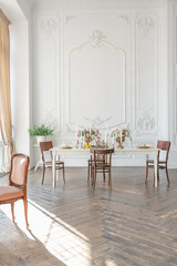 royal baroque style luxury posh interior of large room. extra white, full of day light. high ceiling and walls decorated by stucco