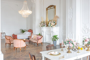 royal baroque style luxury posh interior of large room. extra white, full of day light. high ceiling and walls decorated by stucco