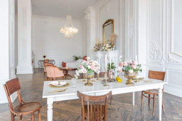 royal baroque style luxury posh interior of large room. extra white, full of day light. high ceiling and walls decorated by stucco