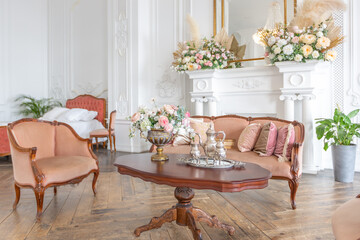 royal baroque style luxury posh interior of large room. extra white, full of day light. high ceiling and walls decorated by stucco