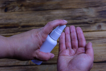 Woman applying hand sanitizer. Healthcare and medicine. Coronavirus pandemic concept