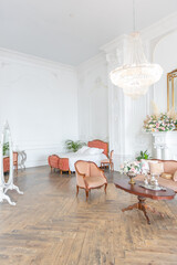 royal baroque style luxury posh interior of large room. extra white, full of day light. high ceiling and walls decorated by stucco
