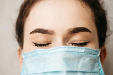 Woman wearing an anti virus protection mask to prevent others from corona COVID-19 and SARS cov 2...