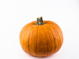 Fresh organic pumpkin on a white background. Halloween pumpkin on a white background. Ripe orange pumpkin on a white background.