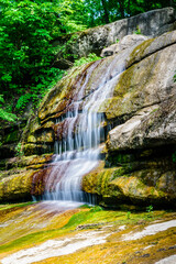 Beautiful waterfall on small river in a park