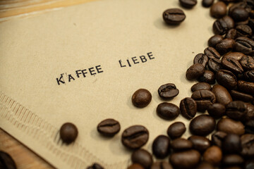 Kaffee Liebe german slogan on coffee filter with stamps and beans deutsch
