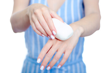 Woman holding white soap in hand on white background isolation