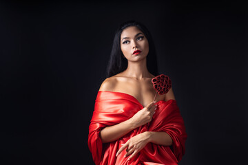 portrait of a beautiful Asian girl with a bright red make-up