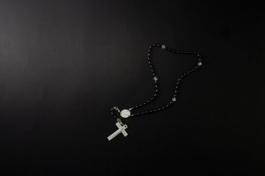 religious background with catholic rosary with crucifix