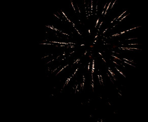 Firework stars, fireworks in the night sky.