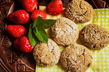 Homemade five cookies with strawberries mint on