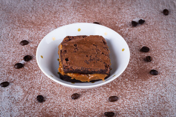 Chocolate brownie with delicious dulce de letche filling. Closeup photography.